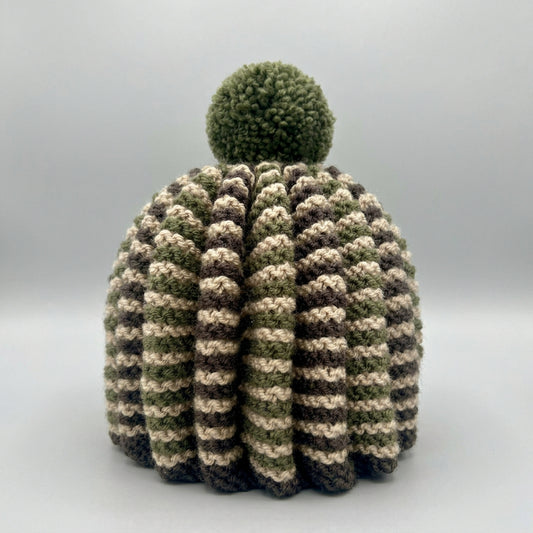 A hand knitted tea cosy