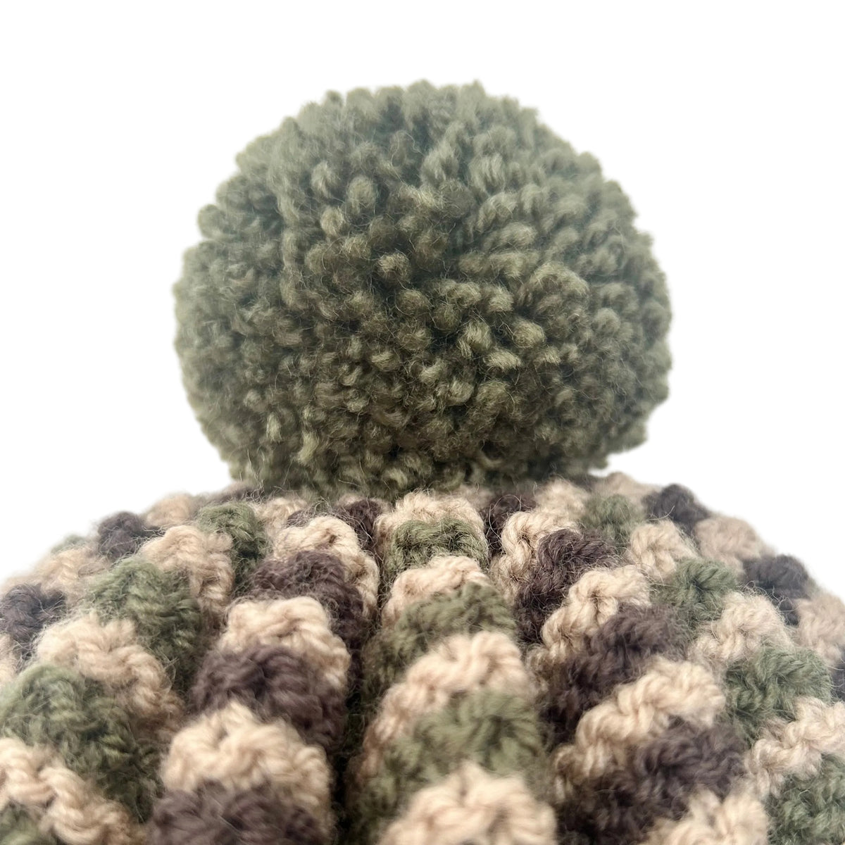 a close up of a handknitted tea cosy